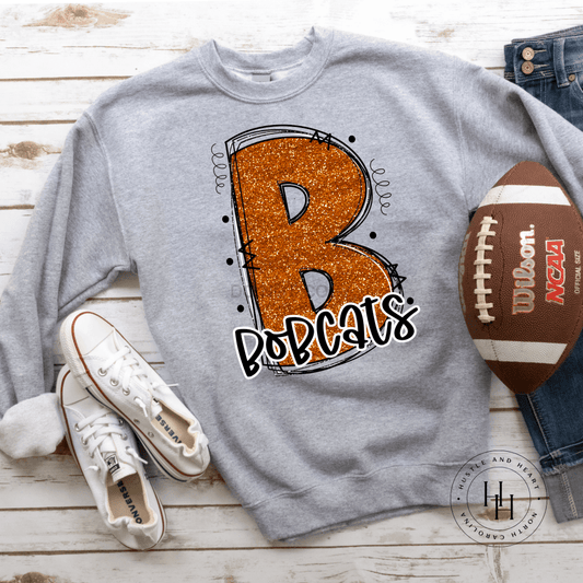 Bobcats Orange Glitter Varsity Doodle Unisex Tee