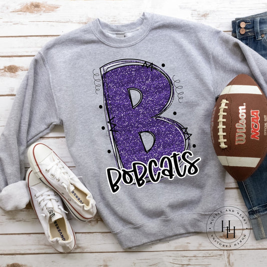 Bobcats Purple Glitter Varsity Doodle Unisex Tee